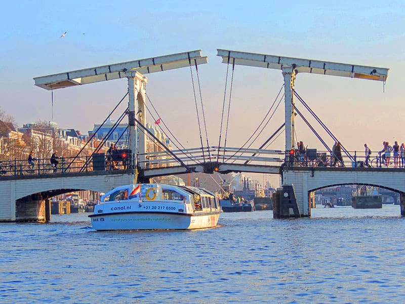 a canal boat going under a bridge