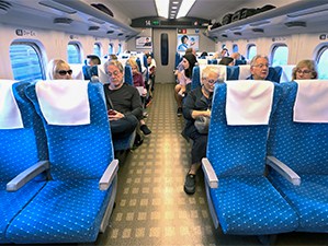 people riding on a bullet train, one of the things to do in Japan