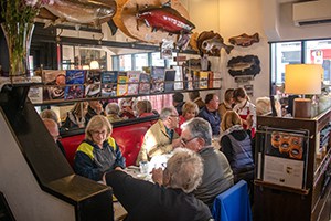 people sitting in a colorfully decorated restaurant