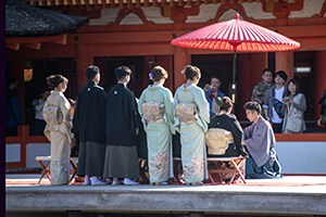 women in kionos at a religious ervice