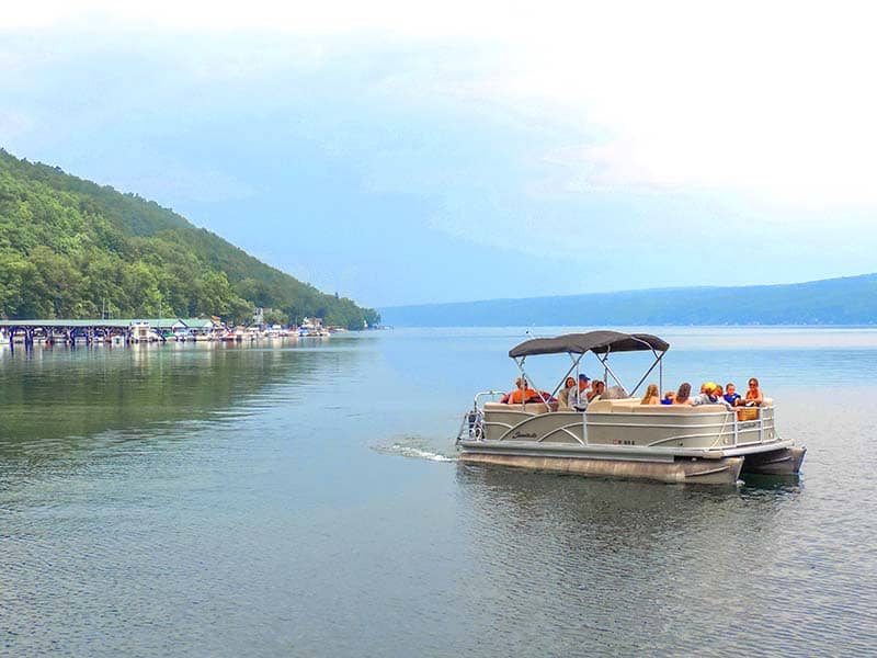 people in a tour boat - one of the things to do in the finger lakes
