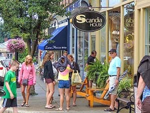 people on the sidewalk in a small town