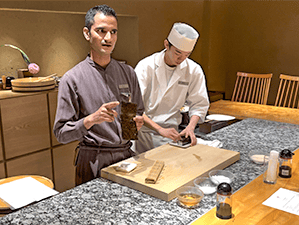 two chefs making sushi