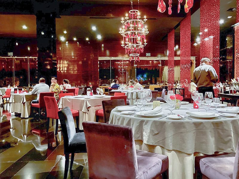 people in an elegant dining room at the Grand Velas Riviera Maya Mexico