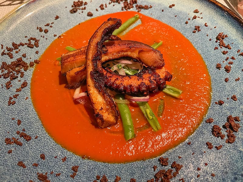 friend octopus on a bright-red plate
