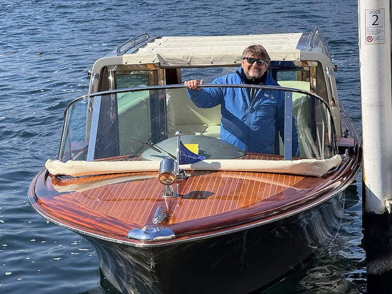 on man in a boat on Lake Como