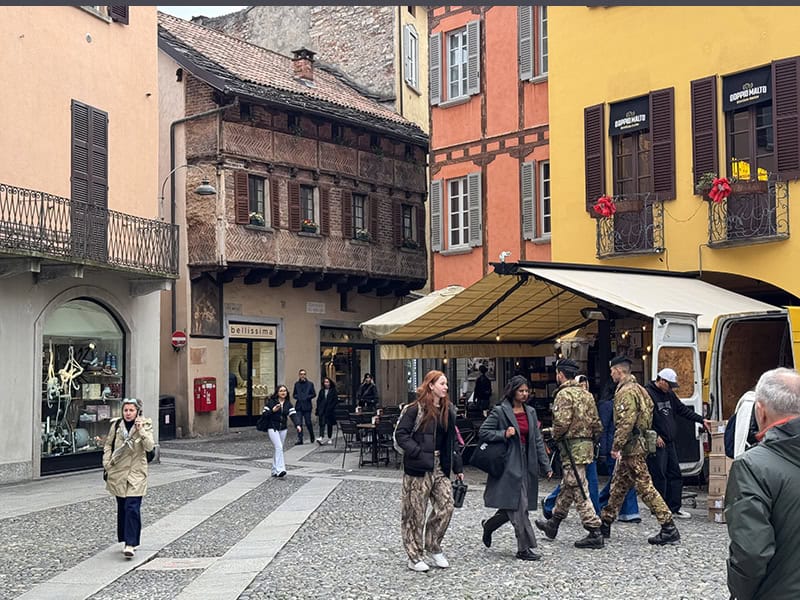 people walking in  an old town on Lake Como