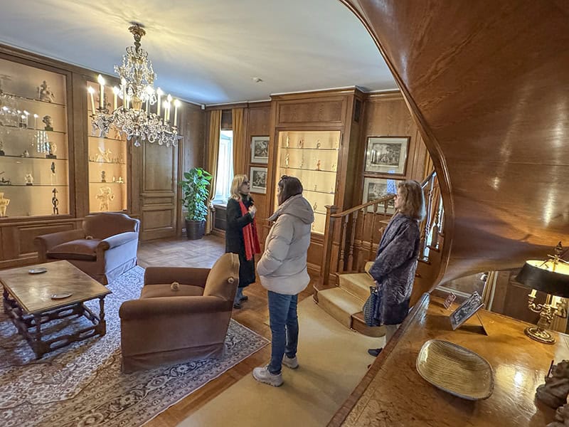 3 women in an old ornate living room
