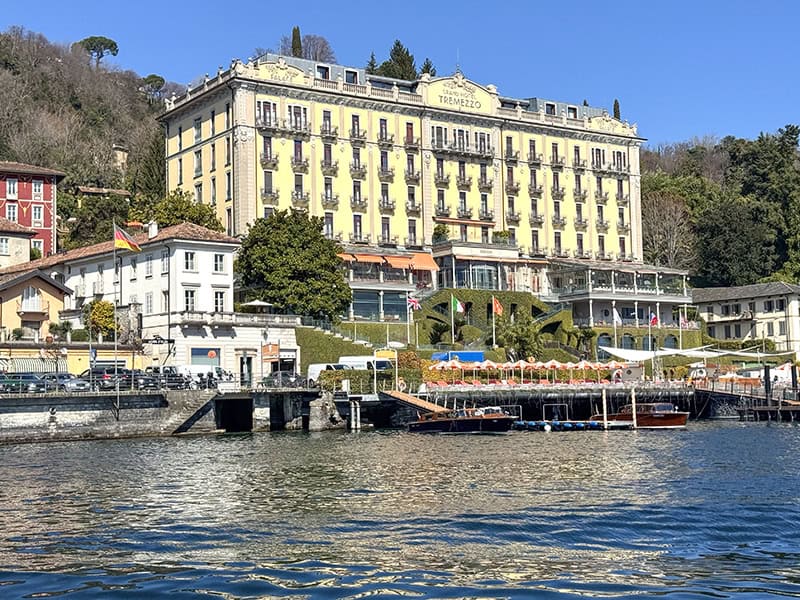 a yellow hotel on a lake