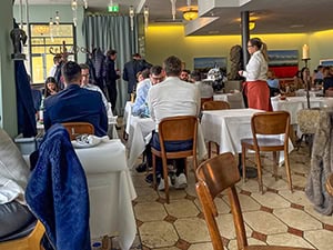 people sitting in a crowded restaurant