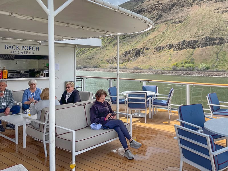 people sitting on the deck during the during American Cruise Lines Lewis and Clark tour