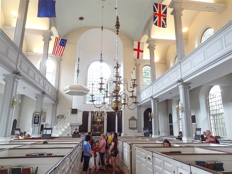 people in an old historic church x visited on a  Freedom Trail Boston self-guided tour