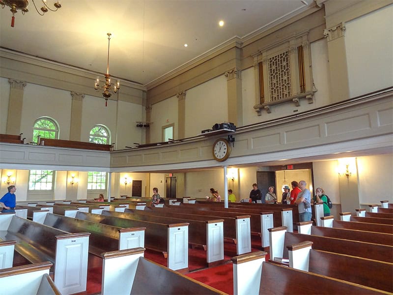 people walking through an old church on a  Freedom Trail Boston self-guided tour