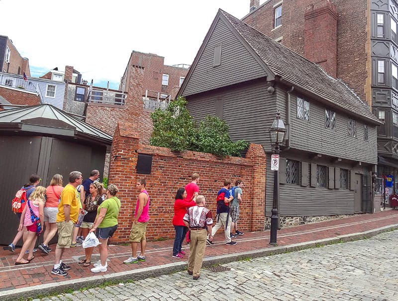 a crowd waiting outside an old house visited on a  Freedom Trail Boston self-guided tour 