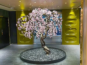 bronze bonsai tree with pink flowers aboard the Regent Seven Seas Grandeur