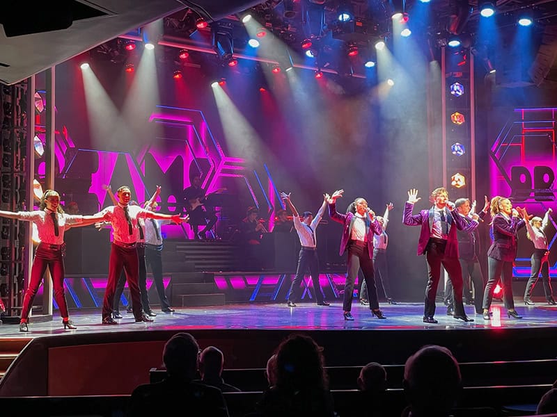 a dance group performing on the Regent Seven Seas Grandeur