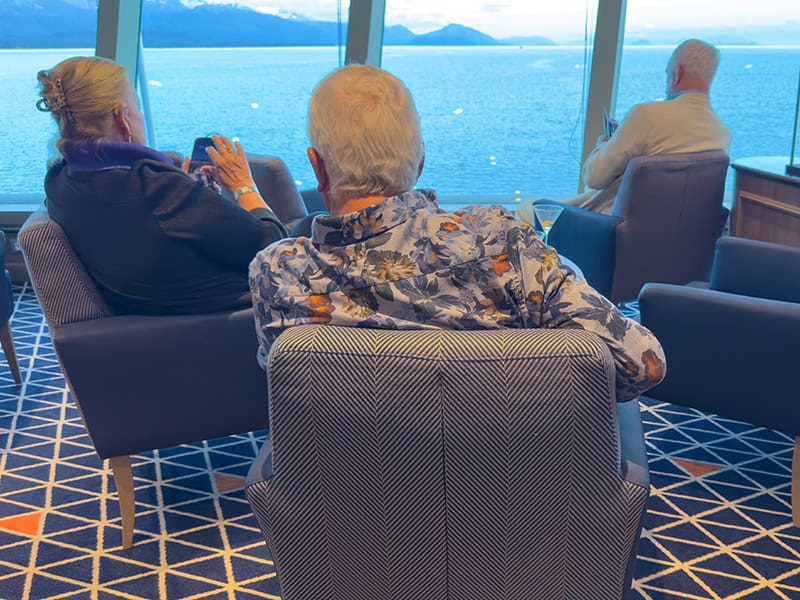 3 people relaing in chairs aboard the Silversea Silver Moon