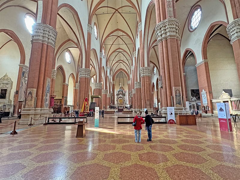 2 womwn in a basilica in Bologna Italy