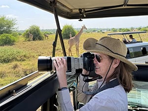 a woman taking a photo on a Nairobi city safari