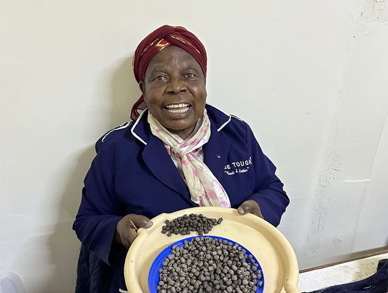 a black woman with a blue jacket  seen on a Nairobi city safari
