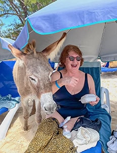 laughing woman and a donkey