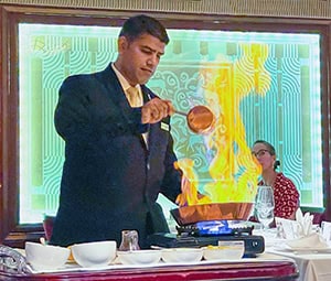 man in a suit flambe desert