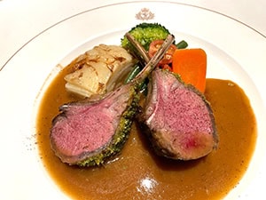 lamb chops on a plate with gravy