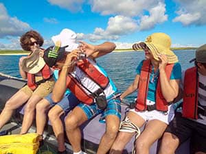 people on a boat taking photos - Galapagos Islands