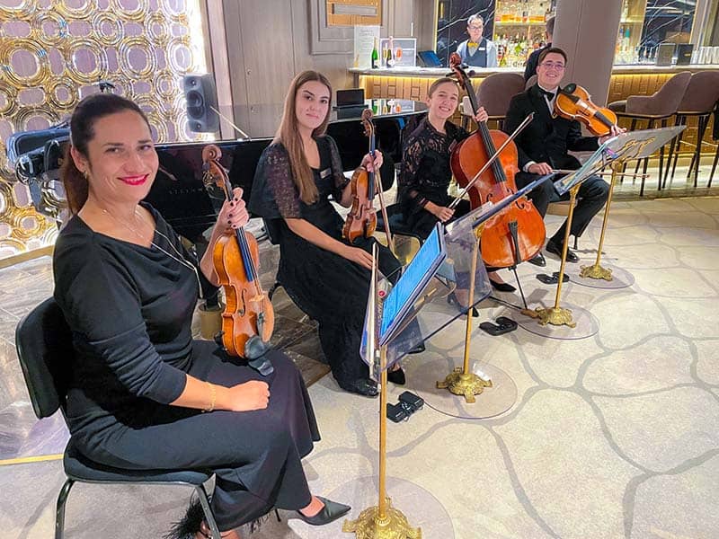 a string quartet on the Oceania Allura