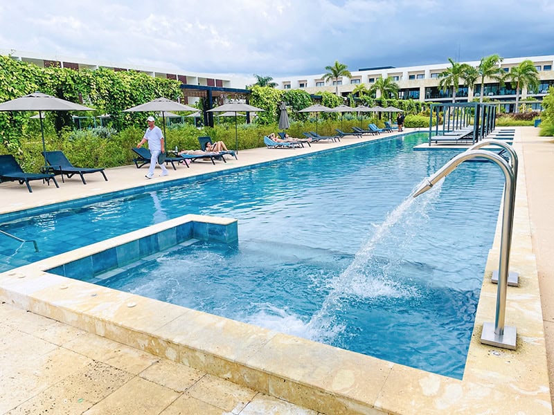people by a swimming pool