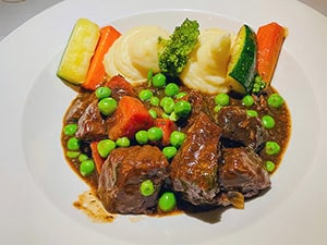 green peas and potatoes on a roast