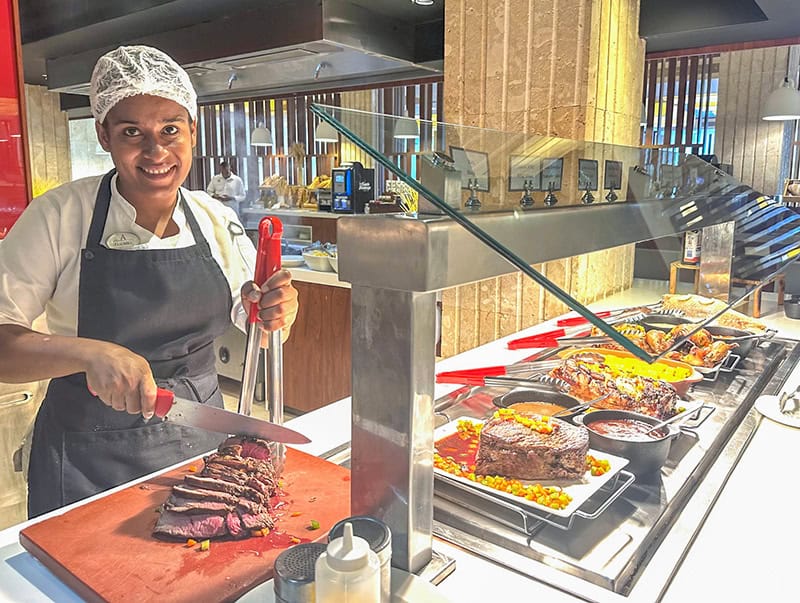 a buffe chef carving meat at Live Aqua Punta Cana