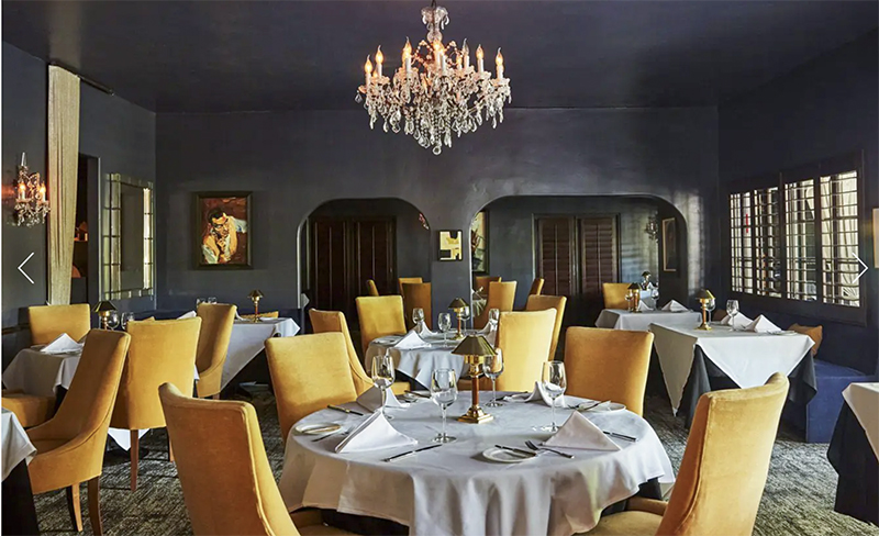 a restaurant with yellow chairs