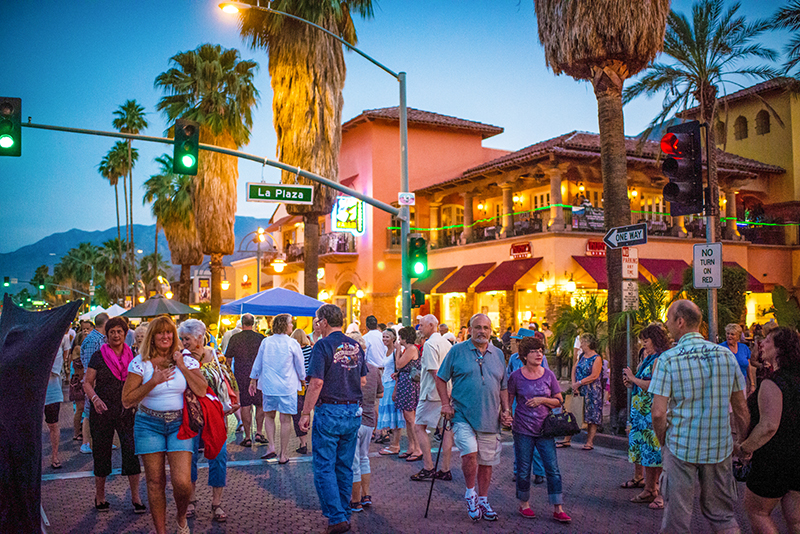 people at a street festival in Greater Palm Springs